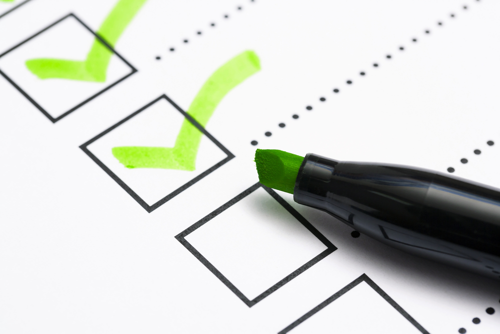 company valuation checklist with green highlighter ticks inside the check boxes