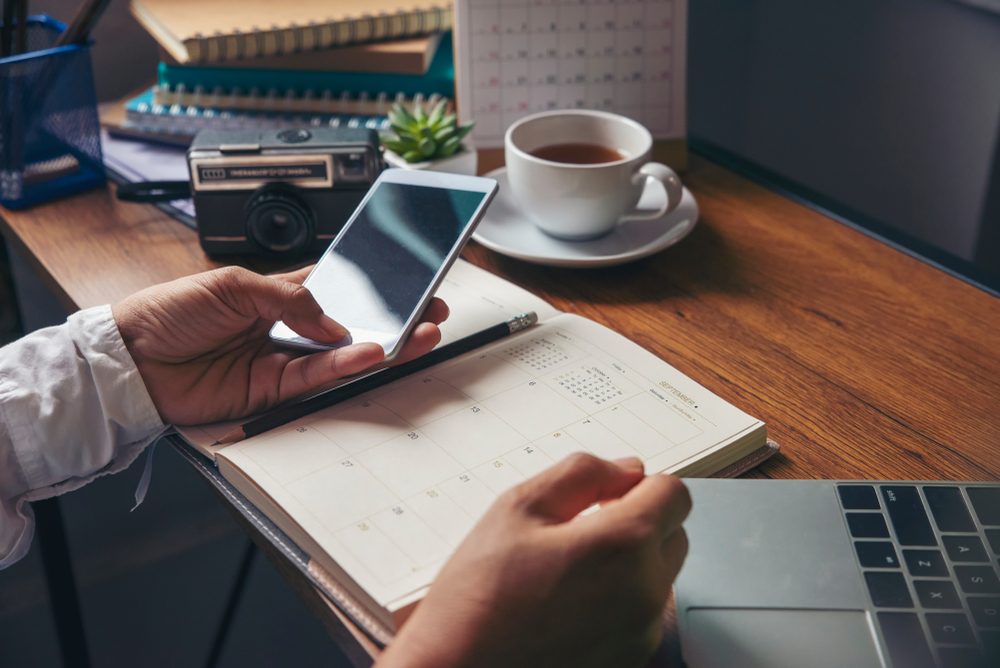 business sales agent working with a calculator to help value a business