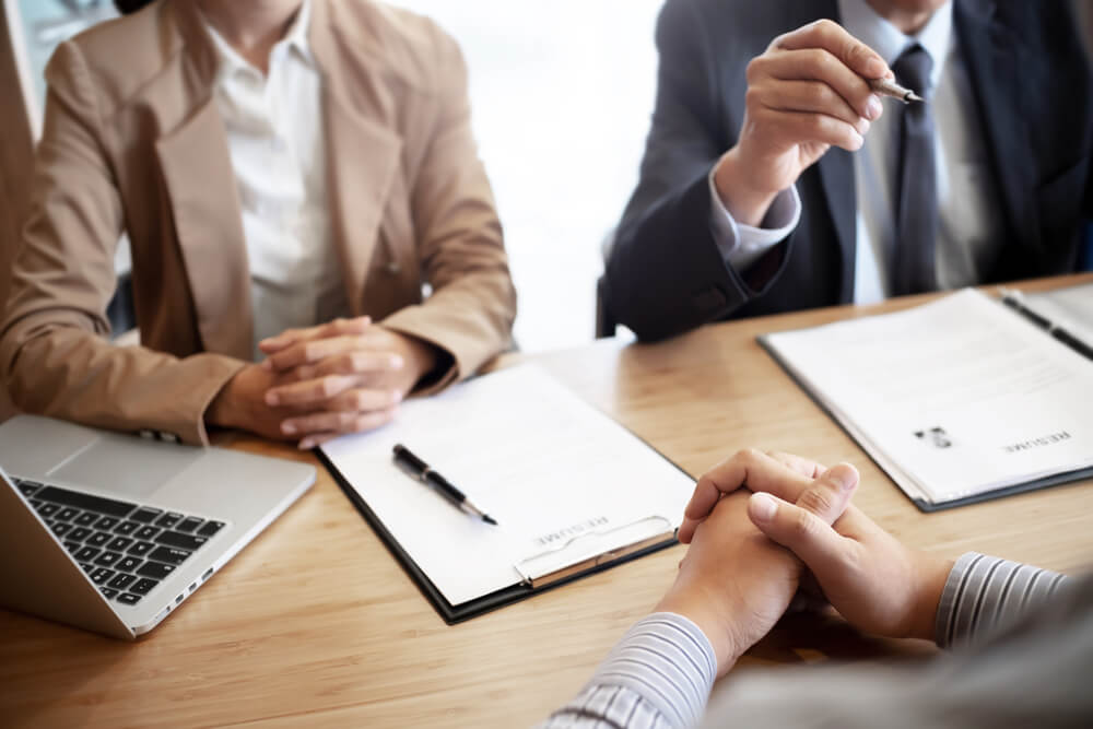 Business owners discussing the sale of a recruitment business with professional advisers