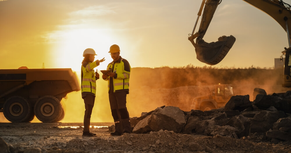 construction male and female co-workers on site