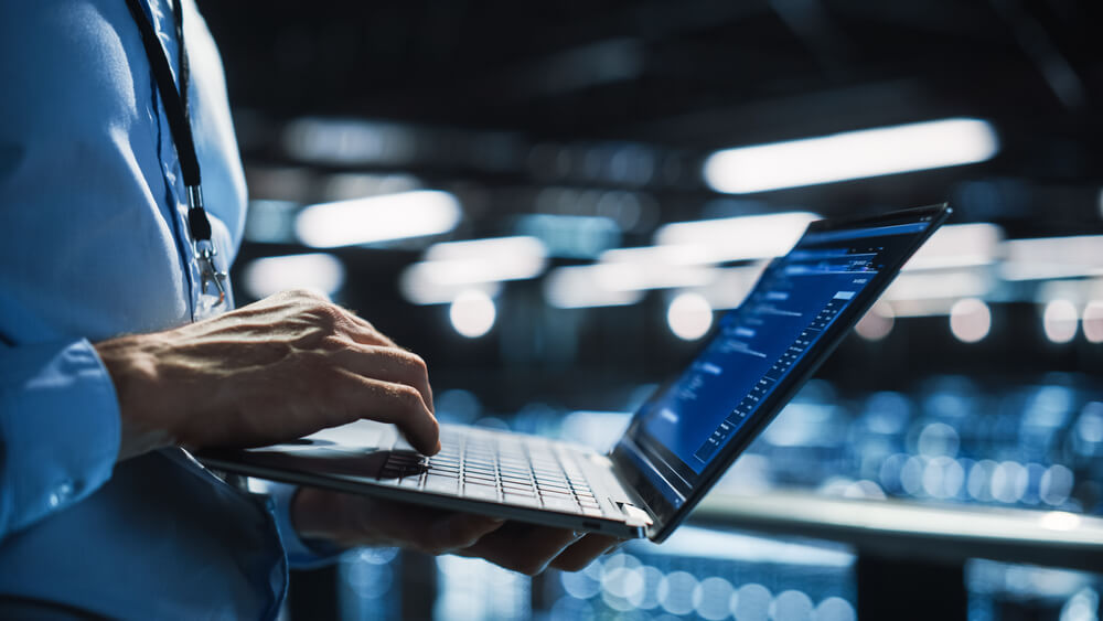 selling a saas company image of business man working on laptop