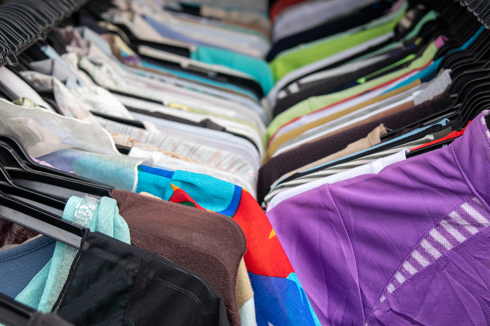Clothing and apparel displayed in a retail store, representing fashion and consumer goods businesses